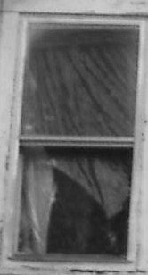 Mans face in upper window